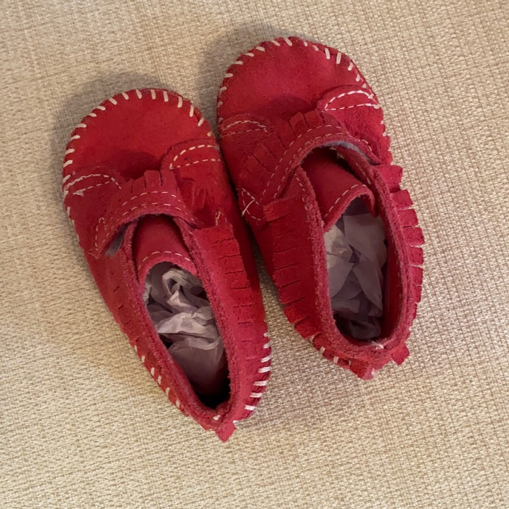 Minnetonka moccasins. Dark pink/magenta color. Size 4.